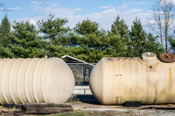 Two large conservancy tanks set up as part of a property’s waste system.