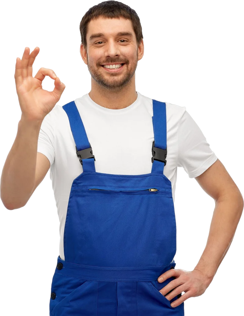 Smiling plumber in blue overalls showing an OK hand sign, representing Deep End Plumbing, an expert plumber in Johannesburg South.