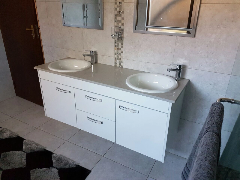 Modern bathroom basins showcasing completed bathroom renovations.
